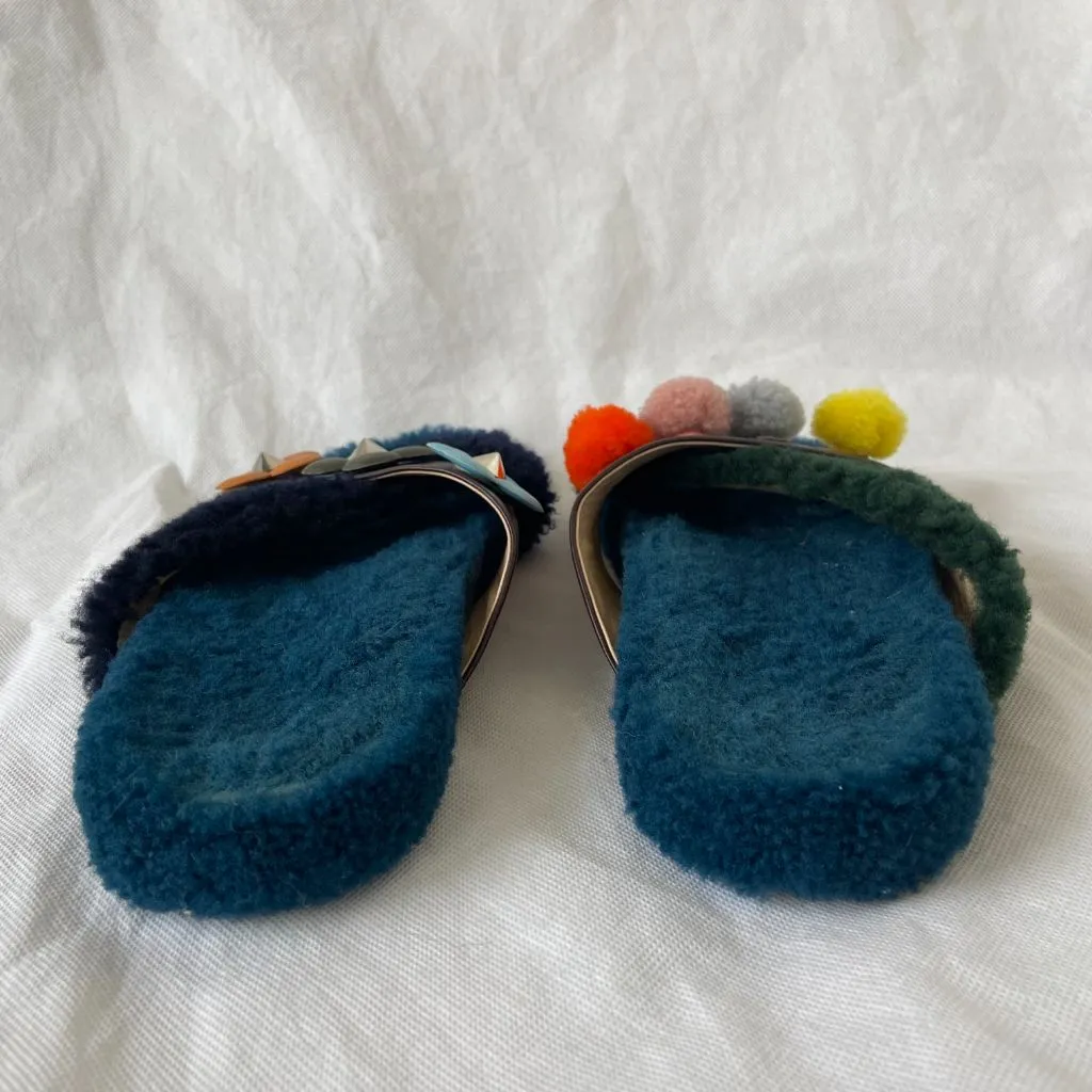 Fendi fur criss cross slides with pom pom embellishments and floral applique, 38